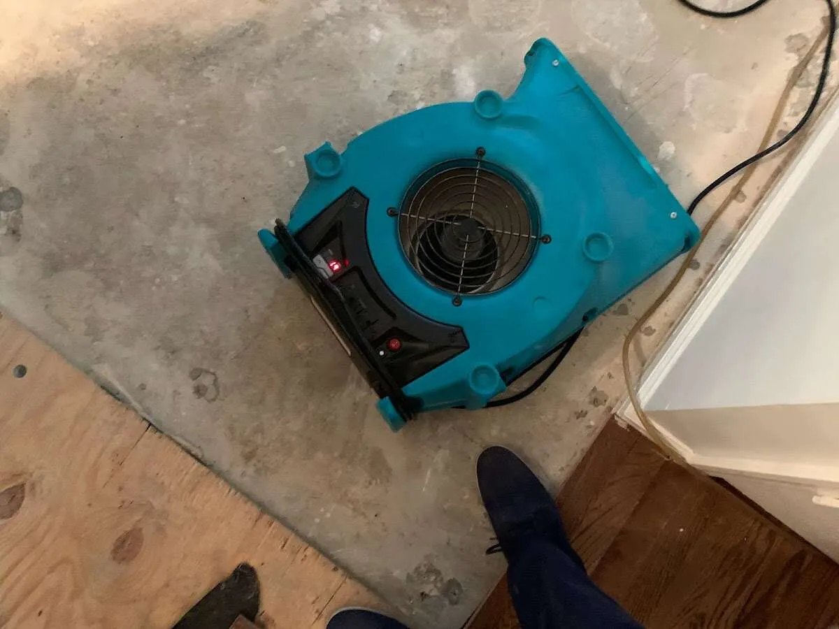 Air mover drying subfloor during Leak Detection & Repair in Woodlake